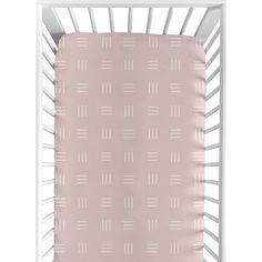 a baby crib with a pink blanket and white trim on the bottom half of it