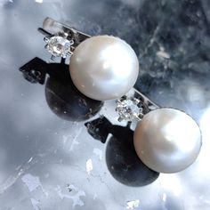 Art Deco 1930s Antique Vintage Earrings 0.7 ct Diamond and Maube Pearl 18k Solid White Gold Earrings Earrings Size: 21mm height Pearl : 15mm. Diamonds: 0.74ct. Cut: old mine Clarity: SI Colour: J Metals Type: 18K Gold Hallmarked Weight: 12.40 grams Condition: Excellent Beautiful, dainty 1930s Art Deco gold diamond and pearl earrings.  Well-made locks provide comfort and security.  These earrings make a great gift for anyone looking for a classic pair of earrings that are great for any occasion!  Your item will be carefully wrapped and shipped insured by Fedex priority Mail. Delivery to your door takes 1-2 days to US, Canada or Europe. When ordering, please give us your phone number for safer Fedex shipping! Vintage White Pearl Pierced Earrings, Vintage White Pearl Drop Earrings, Luxury Vintage Hallmarked Pearl Earrings, Vintage White Pearl Clip-on Earrings, Vintage Metal Clip-on Pearl Earrings, 1930s Art Deco, White Gold Earrings, Wedding Jewelry Earrings, Wedding Earrings