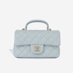 The mini rectangular Chanel flap bag comes with an updated feature of the top handle. Crafted from soft lambskin leather and coupled with pale gold-tone hardware, this little Chanel is definitely hard to get your hands on. The interwoven leather chain allows for the bag to be as a crossbody, as well as carried in your hand. SPL Exterior Baby blue lambskin leather Champagne gold-tone hardware Single flap Top handle Interwoven chain / leather strap CC turn-lock clasp Slip pocket at rear Plaque series Excellent condition - some light markings to the exterior and flattening to the top handle Interior Matching leather lining Single compartment Slip pocket Zip pocket Chanel embossed leather logo Excellent condition - gentle markings under flap Sold with box and dust bag SPL Height 12cm Width 20c Chanel Mini Flap Bag, Chanel Flap Bag, Chanel Mini, Pale Gold, Leather Logo, Vuitton Bag, Champagne Gold, Exclusive Bag, Leather Chain