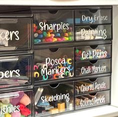 the drawers are labeled with different types of markers and other writing on them for storage