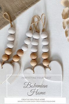 wooden heart ornaments are displayed on a table