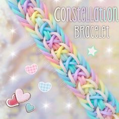 a close up of a rainbow colored chain with hearts and stars in the background that says, congratulations braclet