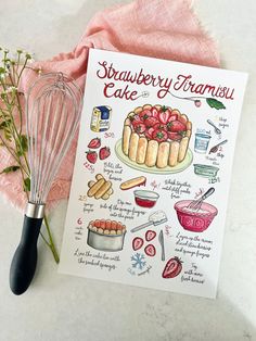 a strawberry tart cake recipe on a card next to a whisk and flowers