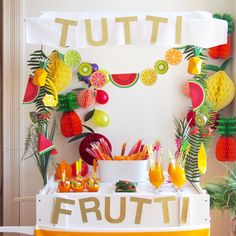 a fruit themed party with oranges, pineapples and watermelon