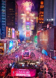 fireworks are lit up the night sky above new york city's times square