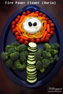 a plate topped with vegetables and a face made out of carrots