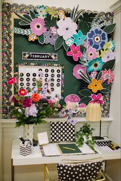 Dark floral paper flowers above a teacher desk. Teacher Classroom Inspiration, Floral Design Classroom, Blooming Classroom Theme, Fun Desk Decor, Classroom Themes Flowers, Rustic Bloom Classroom Theme, Mushroom Classroom Decor, Wildflowers Classroom Theme, Wildflower Classroom Decor