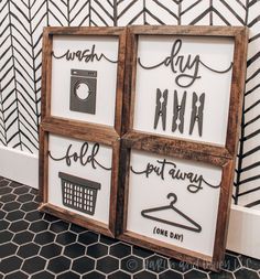 three framed signs with words on them in front of a black and white patterned wall