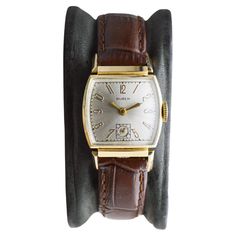 FACTORY / HOUSE: Buren Watch Company STYLE / REFERENCE: Art Deco METAL / MATERIAL: 14Kt Gold Filled CIRCA / YEAR: 1940's DIMENSIONS / SIZE: 42mm Length X 23mm Diameter MOVEMENT / CALIBER: Manual Winding / 17 Jewels / Caliber DIAL / HANDS: Silvered with Gilt Numerals ATTACHMENT / LENGTH: Leather, 14mm / Regular Length WARRANTY: 18 months on the movement This is a "vault find" watch, it has been locked up for nearly 50 years, which means it needs a service. We will give it a factory quality servic Classic Collectible Watch With Rectangular Dial, Classic Watches With Rectangular Dial For Collectors, Classic Collectible Watches With Diamond Hour Markers, Classic Collectible Analog Watch Accessories, Antique Yellow Gold Watch Bands For Formal Occasions, Antique Brown Watch Accessories For Formal Occasions, Vintage Formal Watch Bands With Polished Finish, Vintage Polished Watch Bands For Formal Occasions, Vintage Gold Watch Bands For Formal Occasions