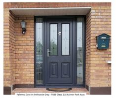 a black front door on a brick building