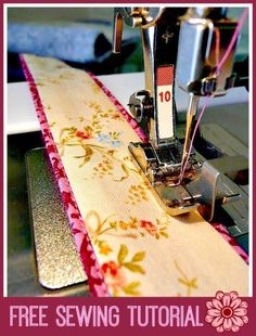 the sewing machine is working on the fabric