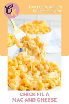 macaroni and cheese is being lifted from a bowl