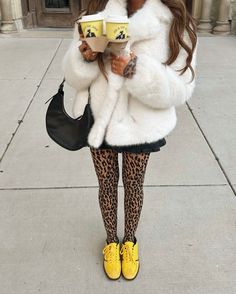 oversized faux fur winter coat, wolford leopard tights, yellow sneakers, winter whites, winter street style