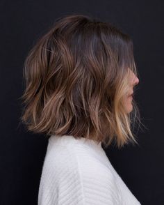 an instagram page with a woman's hair cut