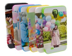 a group of cell phones with different pictures on the front and back covers in various colors