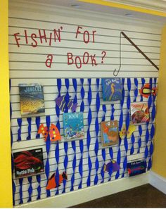 fishin'for a book? bulletin board with fishing theme on the front wall