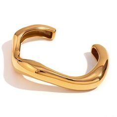 Add some flair to your bracelet stack with the Curvy bangle. This 18k gold plated piece is a statement-making must-have! Luxury Adjustable Hinged Bangle, Luxury Adjustable Flexible Bangle, Gold Plated Tarnish Resistant Cuff Bracelet, Tarnish Resistant Gold Plated Cuff Bracelet, Chic Gold Cuff Bracelet Tarnish Resistant, Trendy Gold-plated Tarnish-resistant Bangle, Chic Gold Cuff Bracelet With Oyster Detail, Chic Gold Oyster Bracelet Cuff, Chic Gold Oyster Cuff Bracelet