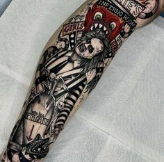 a person with a tattoo on their arm is holding a clock and some other items