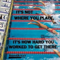 some swimmers are swimming in the pool with their backs turned towards each other and there is an advertisement on the side