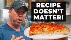 a man holding a plate with a pizza on it and the words recipe doesn't matter