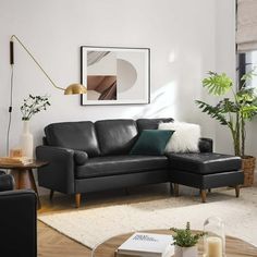 a modern living room with black leather furniture