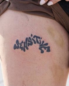 a woman's thigh with the word stencil written on it in black ink