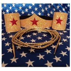 two red stars are on the top of a gold headband