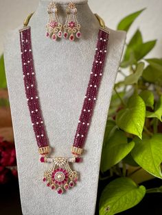 An elegant set for your local gatherings or parties. The length of the Pendant necklace is given in one of the pictures. Measurements of the jhumkas. Height: 6 Cm  Width : 3 Cm  Care Instruction : Avoid Heat & Chemicals Like Perfume, Deo, Alchol, Etc. | Clean With Dry Cotton Cloth | Pack In our Anti tarnish box after use. Festive Dual-tone Chandbali Jewelry Sets, Dual-tone Jewelry Sets For Diwali, Bollywood Dual-tone Jewelry Sets For Festivals, Bollywood Style Dual-tone Festive Jewelry Sets, Bollywood Style Dual-tone Jewelry Sets For Festivals, Festive Dual-tone Bridal Necklace For Diwali, Dual-tone Jewelry Sets For Diwali Celebration, Festive Dual-tone Kundan Necklace For Celebration, Dual-tone Kundan Necklace For Diwali Celebration