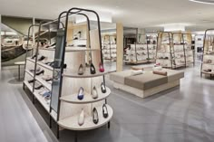 there are many shoes on display in the store