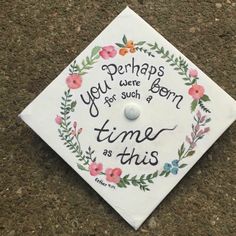 a white graduation cap decorated with flowers and the words perhaps you were born for such a time as this