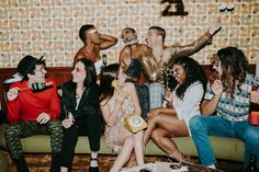 a group of people sitting on top of a couch