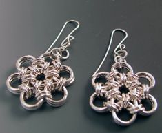 "Japanese Pattern Chain Maille Earrings Sterling Silver We begin by making the correct size individual Sterling Silver circles, then Mary Elizabeth creates the Chain Maille pattern - this one is a Japanese pattern. Beth then makes the Sterling Silver ear wires and additional elements for the final pieces. These are 2\" from the ear hole to the bottom, and the Chain Maille is 1\" in diameter. These are a wardrobe staple - perfect to wear almost anywhere with almost anything - they go from work to Silver Chain Link Earrings As Gift, Silver Chain Link Earrings For Gift, Metal Earrings With Hook And Links For Gifts, Chain Maille Patterns, Crafting Wire, Wire Jewelery, Hardware Jewelry, Diy Collier, Handmade Chain