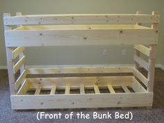 a bunk bed made out of wooden pallets with the bottom section missing from it