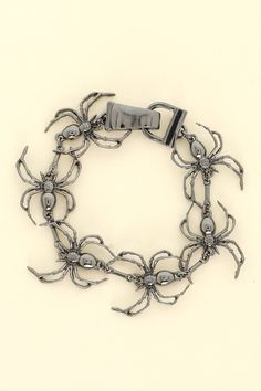 This Spooky Spider Magnetic Link Bracelet is the perfect accessory for adding a touch of spooky style to your outfit. Its magnetic link design ensures a secure fit, while the spider charm adds a playful and fun touch. Lead and Nickel Compliant Length: 7.5" Width: 0.75" Ships with love from our warehouse in Smithfield,VA Silver Novelty Bracelets For Party, Novelty Silver Halloween Bracelet, Silver Halloween Novelty Bracelet, Novelty Silver Bracelet For Halloween, Spooky Style, Spooky Spiders, Link Design, The Spider, Scarf Hairstyles