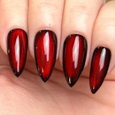 Pictured in medium stiletto and medium square.  Black Apres Gel X press-on nails with silver reflective cat eye topped with blood red jelly color gel. Looks completely black until the light hits just right, revealing a striking blood-red hue, almost appearing as if it's lit from within. Please note: colors and shine will vary depending on photography, lighting and angles. --MATERIALS AND CRAFTSMANSHIP-- This set is crafted with meticulous care using high-quality UV gel materials, including Après Red And Black Magnetic Nails, Black Cherry Cat Eye Nails, Red Reflective Nails, Blood Red Cat Eye Nails, Red Black Chrome Nails, Red Jelly Cat Eye Nails, Red And Black Chrome Nails, Red And Black Cat Eye Nails, Moulin Rouge Nails