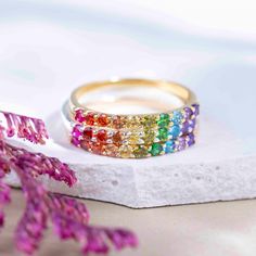 ---------------------------------------------------- Rainbow Eternity Band THE PRODUCT - Weather you're buying this for your love of rainbows, multiple gemstone properties, to show your support of the LGTBQ+ community, or celebrate your pet who have crossed the rainbow bridge, this is the most beautiful all natural gemstone rainbow ring you will ever find!  - This handmade eternity band is made with natural : ruby, garnet, citrine, lemon topaz, peridot, emerald, blue topaz, and amethyst. - We ha Round Multicolor Jewelry For Promise, Rainbow Cubic Zirconia Stackable Jewelry, Rainbow Multi-stone Round Rings, Rainbow Stackable Jewelry For Promise Ring, Adjustable Multi-stone Rainbow Jewelry, Multicolor Jewelry For Pride Gift, Pride Multicolor Jewelry Gift, Fine Jewelry Rainbow Rings As Gift, Rainbow Cubic Zirconia Stackable Rings