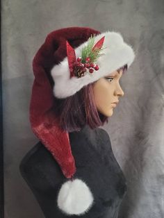 This hat is made from an ultra soft, plush fur in a rich cranberry red. It is a longer, stocking style hat that is over two feet long from the brim to the ball and is trimmed with a snowy white trim. This hat will fit a 22 to 24 inch head and it is available on it's own, or with a cluster of holiday berries and snow kissed pine that are tied with a ribbon and sewn onto the hat. If you need special sizing, message me. Custom orders are welcome. White Tinsel, Holiday Berries, Christmas In July Sale, Stocking Hat, White Stockings, Soft Hats, Red Sequin, White Fur, Beautiful Hats