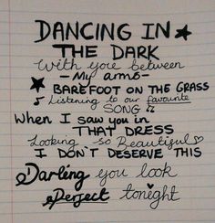 a handwritten poem on lined paper that says dancing in the dark with you between my feet