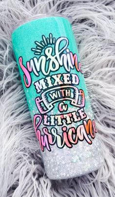 a can that is sitting on some furry fur with the words sunshine mixed in it