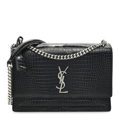 This is an authentic SAINT LAURENT Calfskin Crocodile Embossed Large Monogram Sunset in Black. This stunning shoulder bag is crafted of croc-embossedcalfskin in black. The bag features a silver chain, a front-facing flap with a signature YSL logo, gusseted sides and an exterior pocket. This fold-over bag is complete with magnetic snap that opens to a black suede interior with a patch pocket. Ysl Crossbody, Ysl Crossbody Bag, Ysl Logo, Stylish Shoulder Bag, Monogram Bag, Saint Laurent Bag, Wallet Chain, Leather Silver, Small Shoulder Bag