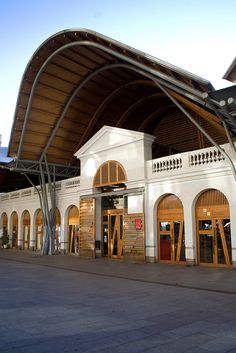 a train station with an awning over the entrance to it's doors and windows