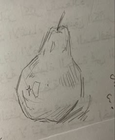 a pencil drawing of a pear sitting on top of a piece of paper