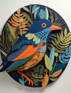 a paper cut bird sitting on top of a blue plate with leaves and plants around it