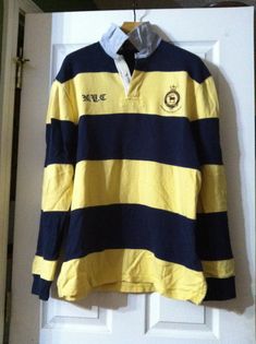 polo ralph lauren men's pre-owned yellow/blue 100%cotton long sleeve equestrian polo shirt size: XL custom fit personal collection underarm to underarm: 23 1/2" underarm to end of sleeve: 20 1/2" shoulder seam to shoulder seam: 21" length from the back of the collar to hem: 32 1/2" Long Sleeve Cotton Polo Shirt For College, Cotton Long Sleeve Polo Shirt For College, Yellow Long Sleeve Cotton Polo Shirt, Ralph Lauren Polo Shirt, Ralph Lauren Polo Shirts, Ralph Lauren Polo, Polo Ralph Lauren Mens, Dress Code, Dress Codes