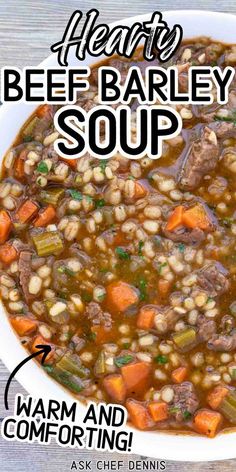 a bowl of beef barley soup with carrots and celery on the side