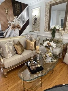 a living room filled with furniture and a stair case