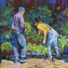 two men are tending to plants in the garden