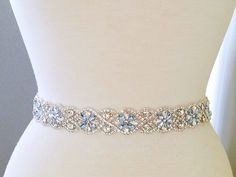 20" Jeweled part, Wedding Belt, Bridal Sash Belt - SILVER Clear Stone & Lucky Light Blue Stone Wedding Sash Belt Applique size - approximately  20" long and 1 1/8" wide.   (widest point).  ** Self tie ribbon ties in the back. Total sash belt is measuring about 3.5 yards, 7/8" width wide.  ** Double face satin ribbon colors are available in White, Off White, Ivory, Black, Navy and Silver Grey, BLUSH, OLD GOLD, LIGHT BLUE    Please select the sash color from the drop down menu **Due to all product Nye Wedding, Bridal Sash Belt, Wedding Sash Belt, Stone Wedding, Satin Sash, Wedding Sash, Bridal Sash