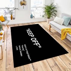 a black area rug with the words keep off on it