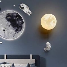 an image of a bedroom with the moon and stars on it's wall decals